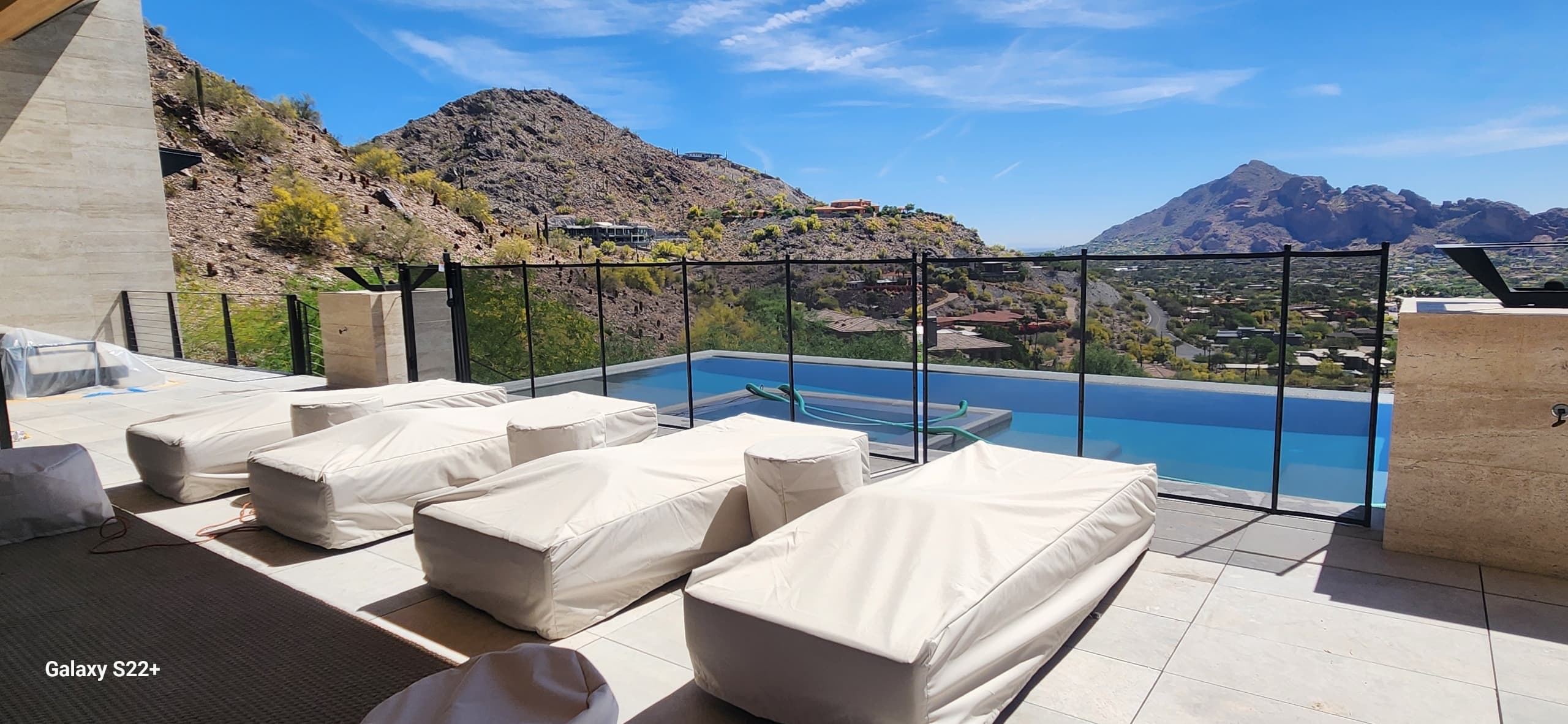 Removable mesh pool fence — hillside infinity pool, Scottsdale AZ