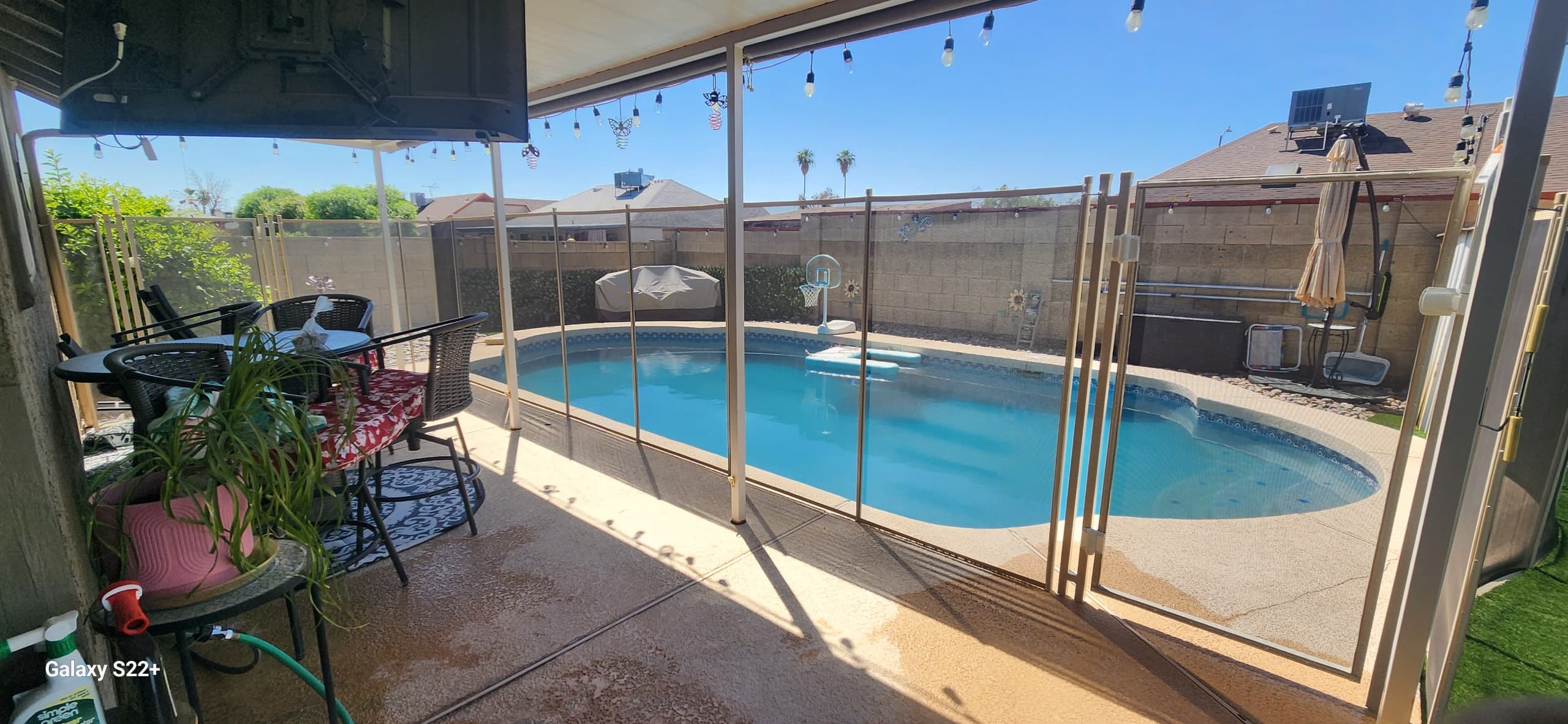 Beige mesh pool fence — round pool, patio view, Maricopa County