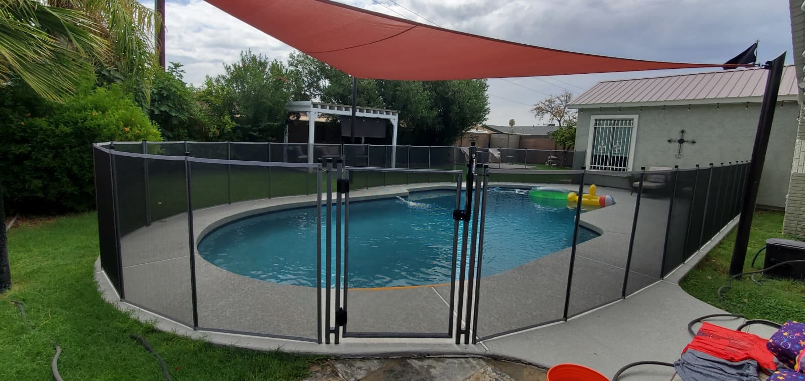 Pool fence around pool — Clear Choice Pool Fence, July 2022